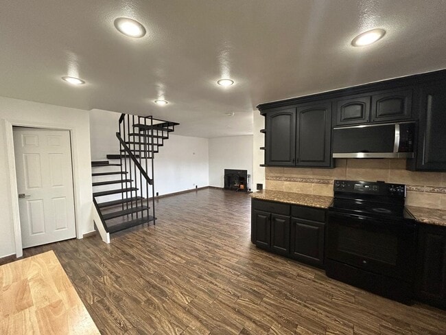 Building Photo - Beautifully Updated 3-Bedroom Townhome with Fireplace, Private Patio & Community Pool $3,195