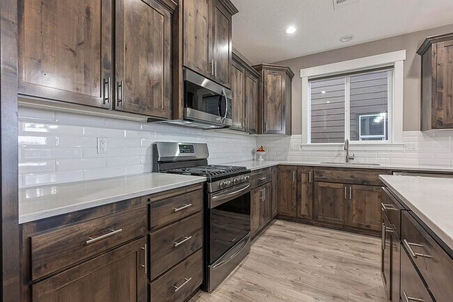 Building Photo - Modern 4BD/3BA Rental with Garage & Fenced...