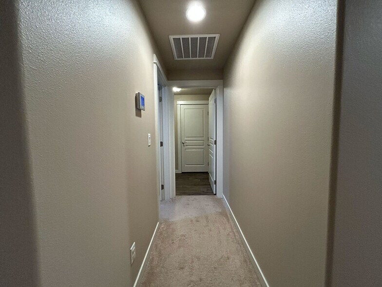 Hallway to Bedroom 2 & Laundry Room - 511 Casting St SE