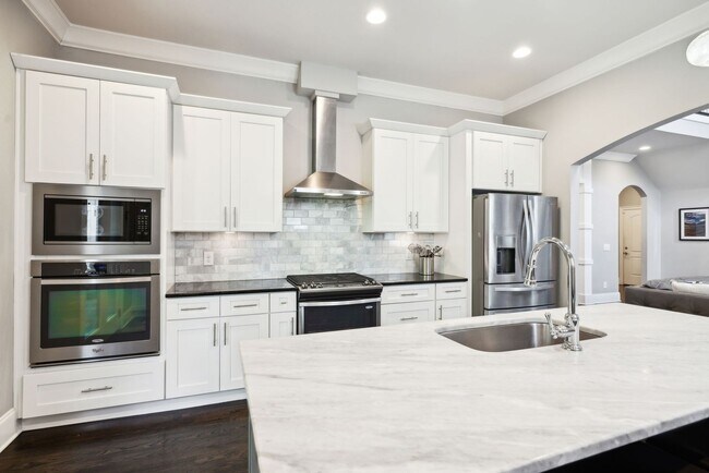 Building Photo - Welcome to this beautifully designed 4-bed...