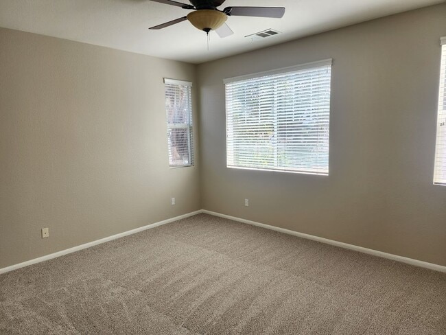 Building Photo - Two Story 3 Bedroom Townhome with 2 Car Garage in Gated Community