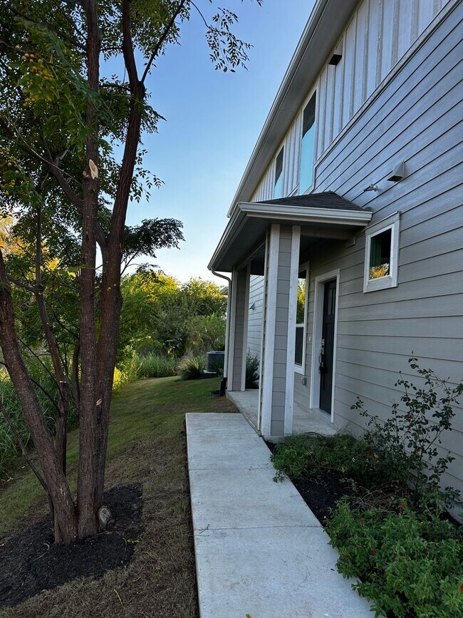 Building Photo - For Lease – Modern 2023 Condo Backing to Greenbelt | Creekside at Pioneer Crossing West