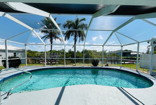 Building Photo - SOUTH GULF COVE-WATERFRONT POOL HOME!