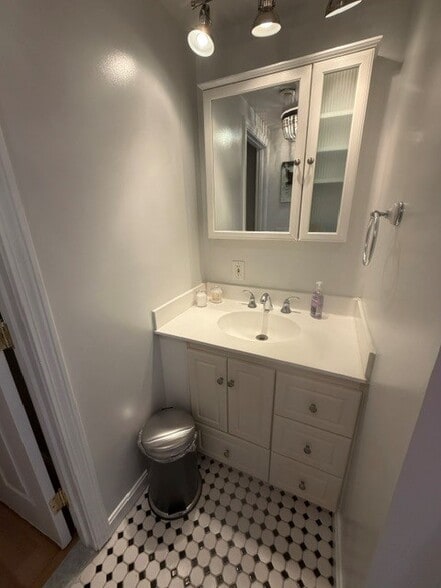 Bathroom vanity with plenty of light and storage - 87 Washington Ave