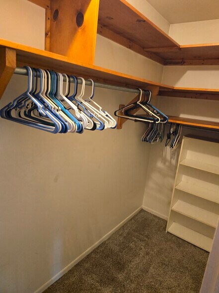 Master bedroom walk-in closet organization - 2112 Clarence Ave