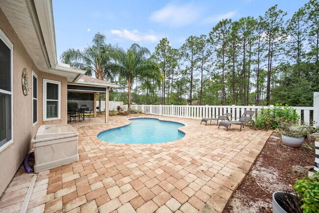 Building Photo - Luxurious Palm Coast Retreat: 4-Bed 3 Bath Pool Home