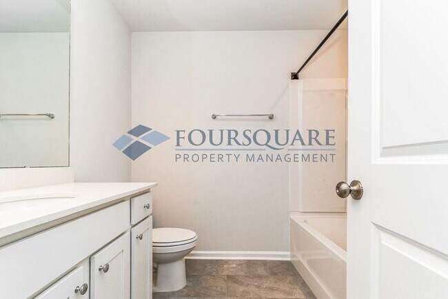 Building Photo - Modern End-Unit Townhome with 2-Car Garage | Pet Friendly