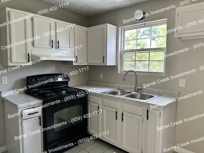 Primary Photo - 2-Bed, 1-Bath Townhome with Attached Garag...
