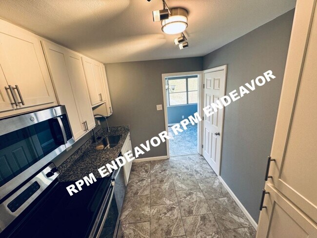 Building Photo - "Charming 4-Bedroom Haven with Sunroom, Ha...