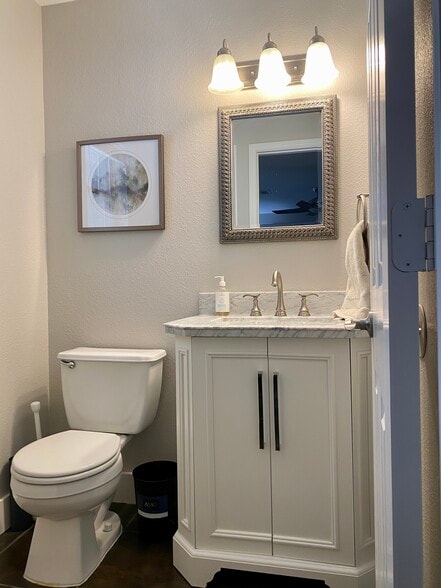 Downstairs half bath off living area - 615 Big Spring Dr