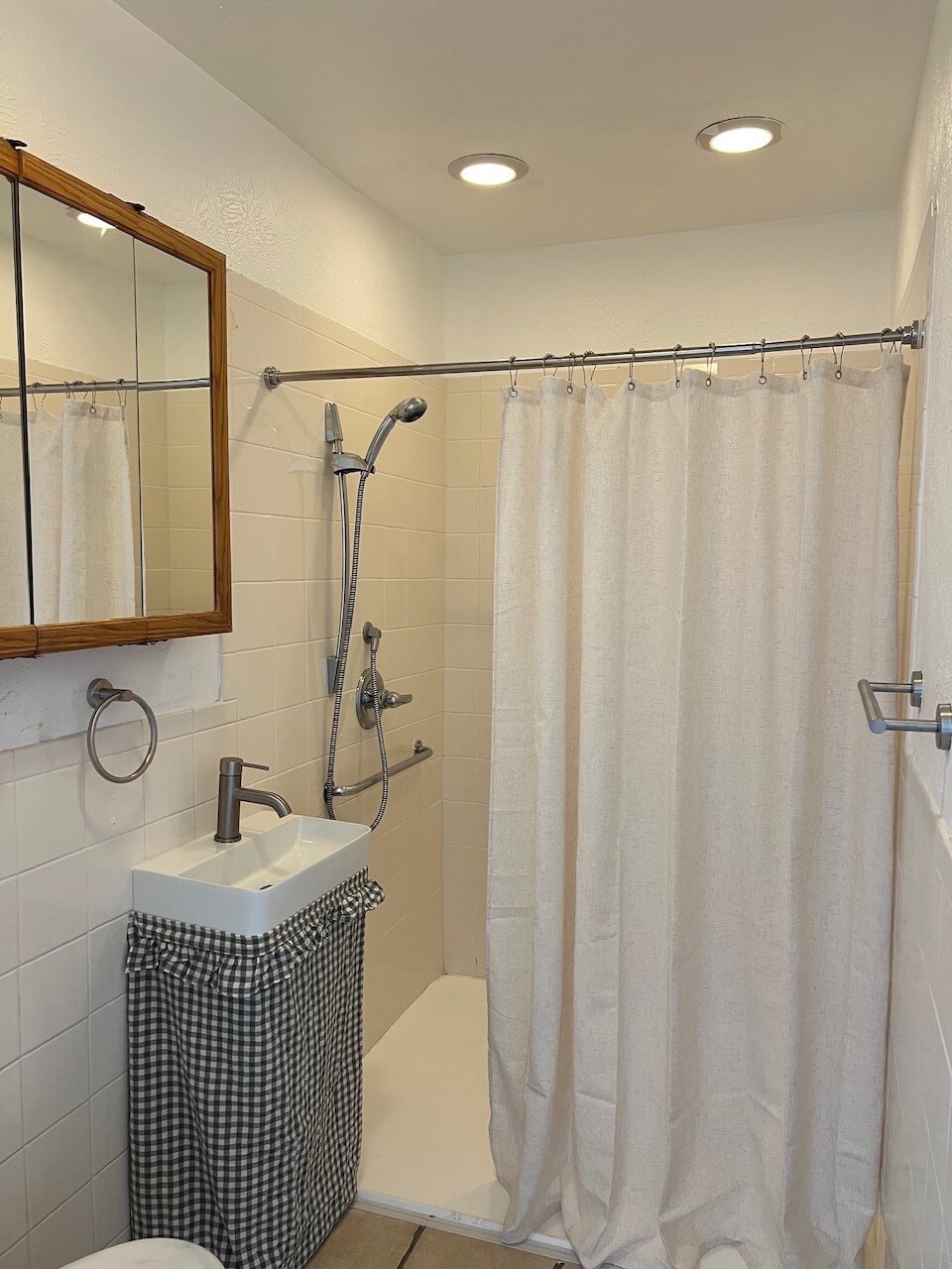 Main floor full bath, large shower and medicine cabinet. New sink and hardware - 6396 E Mississippi Ave