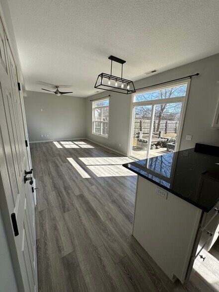 Kitchen + Dining Room - 411 Treeline Cv