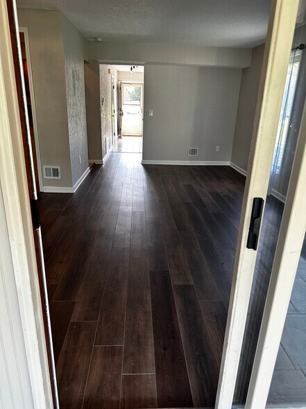 Walking from 3 season room into living room/dining room - 4B Kimberly Ct