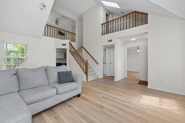 Building Photo - Spacious 3BR Retreat with Soaring Ceilings & Screened Porch