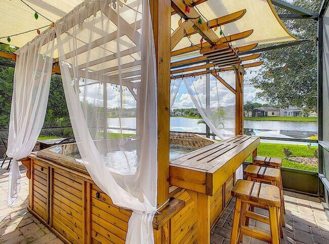 Building Photo - Luxury Living in Woodland Lakes Preserve: Fully-Furnished