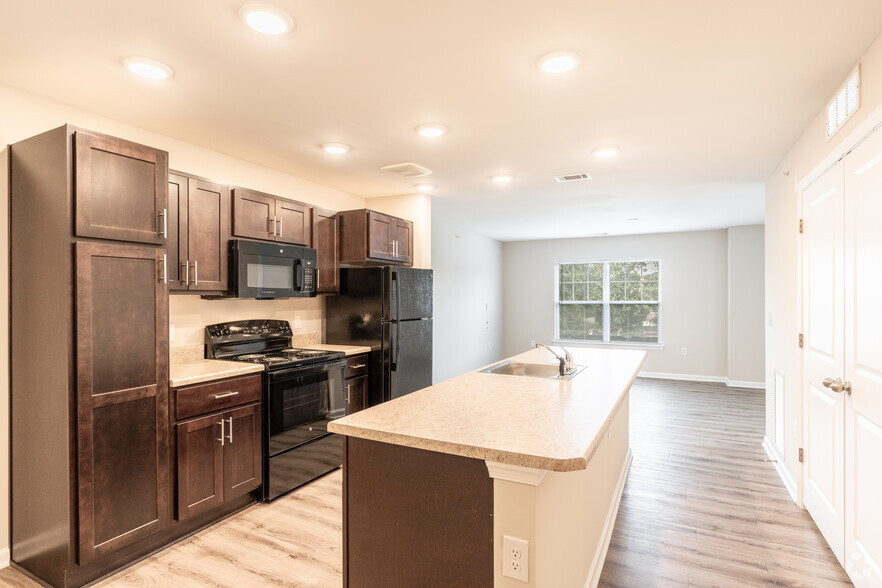 2BR, 1.5BA - Kitchen & Living Room - The Arbors at Hull Street Senior Apartments