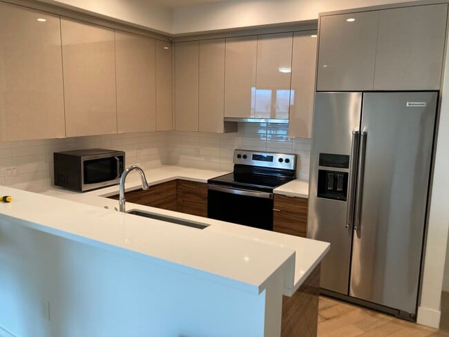 Building Photo - Live at the beach! Modern 2 bedroom 2 bath condo blocks from the beach w/parking and washer/dryer...