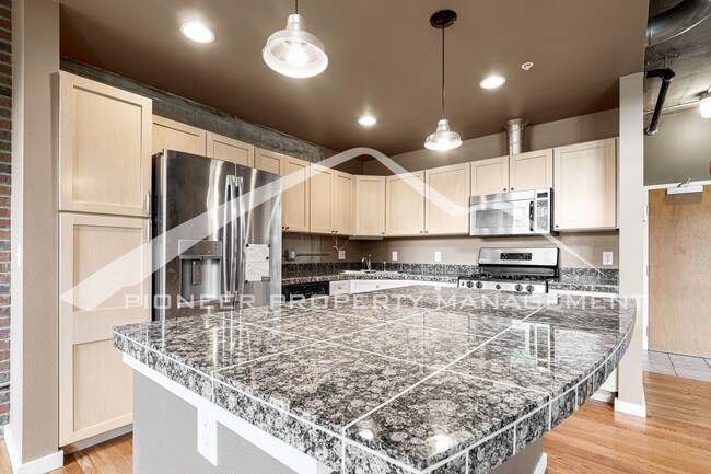 Building Photo - Modern Industrial Condo Downtown with Park...