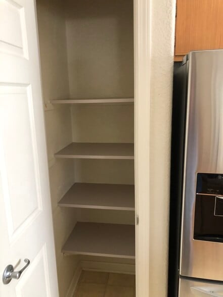 Pantry for food storage next to fridge - 10001 Woodcreek Oaks Blvd