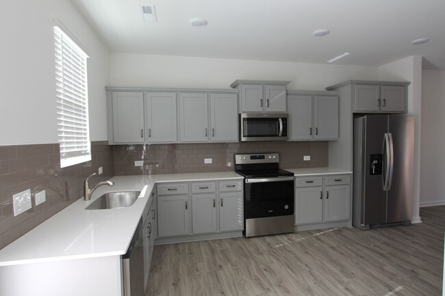 Building Photo - NEW 3 Bedroom Townhome Minutes from Downto...