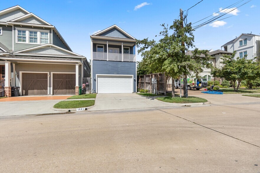 Front view from W 23rd street. House is facing South. Driveway and garage can each fit 2 vehicles - 1221 W 23rd St