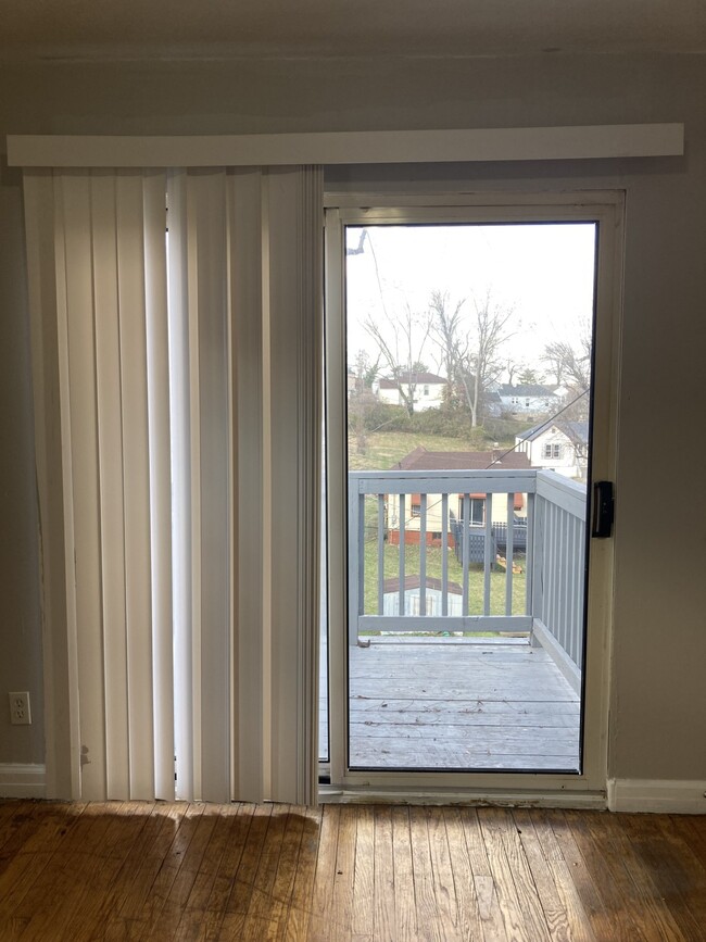 Sliding glass doors leading to the balcony - 8805 Tyrell Dr