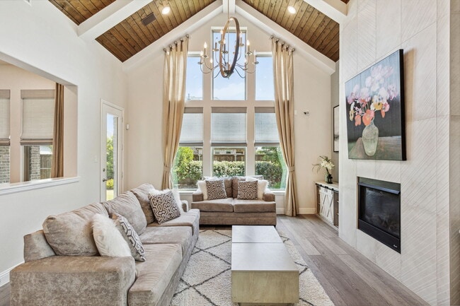 Living room with cathedral ceilings with a view of the backyard - 2871 Cannon Dr