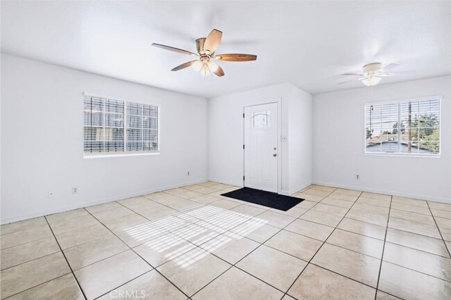 view of living room + front door - 3081 Inez St