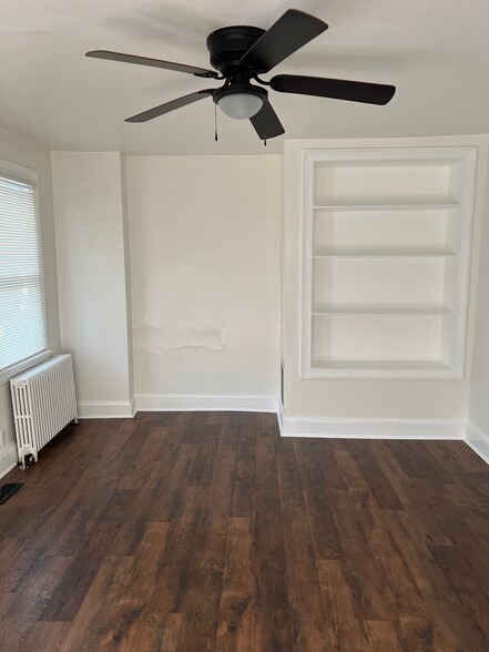 The living room features a large built-in, perfect for books and decor. - 126 Merion Ave