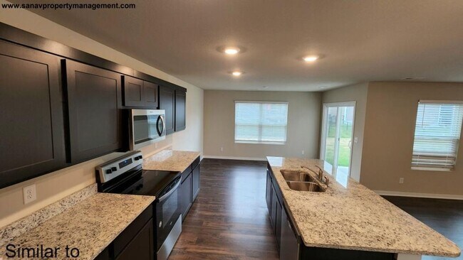 Building Photo - "Modern Luxury: Spacious 4-Bedroom Home with Open-Concept Design"