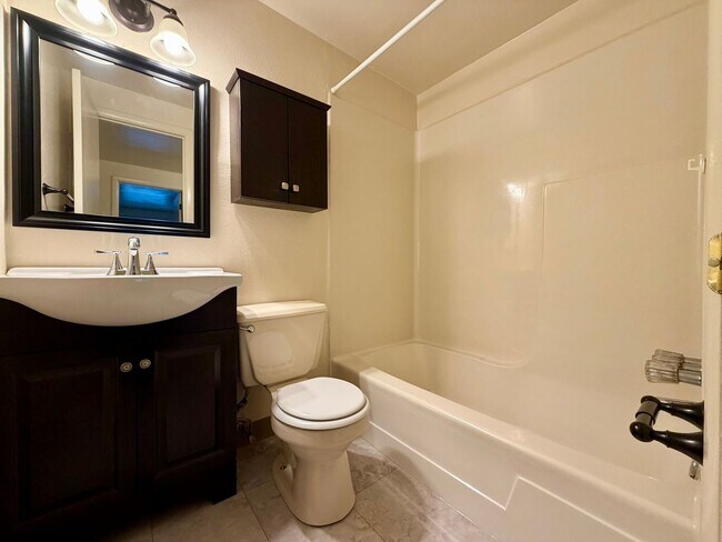 Building Photo - Stunning 2 BR Townhouse with Attached Garage! Central A/C & MORE!! CALL TODAY TO SCHEDULE A TOUR!