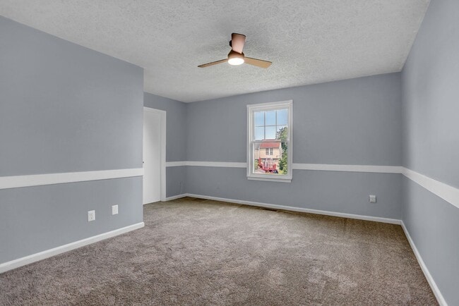 Building Photo - Spacious 4-Level Home with Deck, Workshop ...