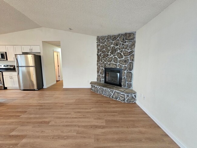 Building Photo - Charming Single-Level Home Featuring New Hardwood Floors, Bright Bedrooms & Open-Concept Living