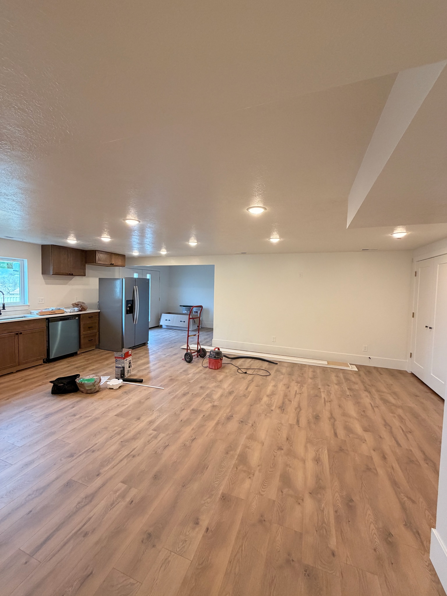 View of kitchen, living room, dining room, and entry into unit. - 14 N 300 E