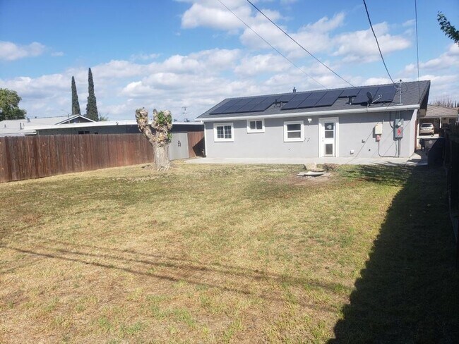 Building Photo - Beautifully Renovated Home with Updated Kitchen and bath, paint, and flooring! FREE SOLAR TOO!!!!