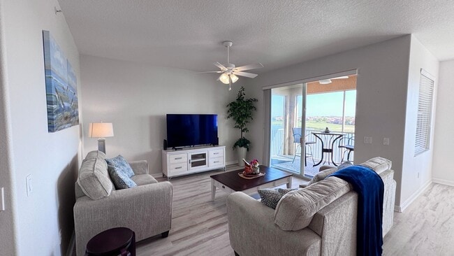 Building Photo - Elevated Luxury at The Terraces – 4th Floor Lake & Golf Course Views! 55+ Community!