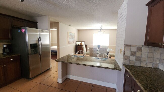Building Photo - The Woodlands of Palm Coast- FURNISHED- 4 Bedroom 2 Bath- Long Term