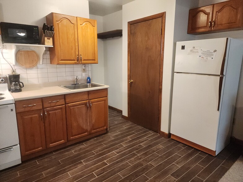 New tile floor, refrigerator, closet, storage - 19 Overbrook Dr