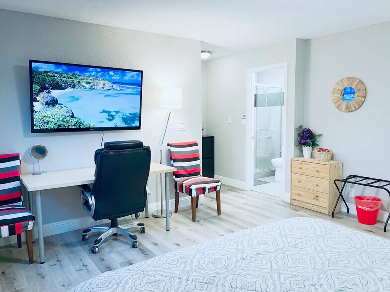 103 - 55" Smart TV with huge adjustable desk (outdated photo) - 1495 Kavanaugh Dr