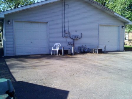 Garage entrance off of alley with paved parking. - 919 Cherry Street