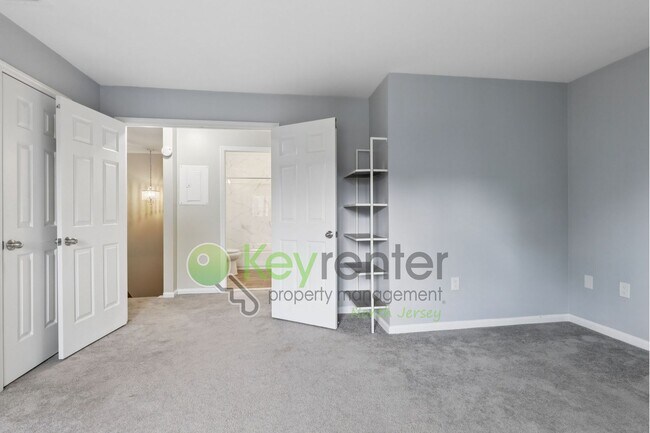 Building Photo - Spacious 2BR/2BA Duplex in Gated Community with Parking, Washer/Dryer & NYC Skyline Views