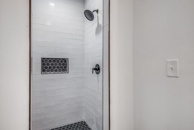 Building Photo - Live Stylishly. Live Comfortably. Live Mem...