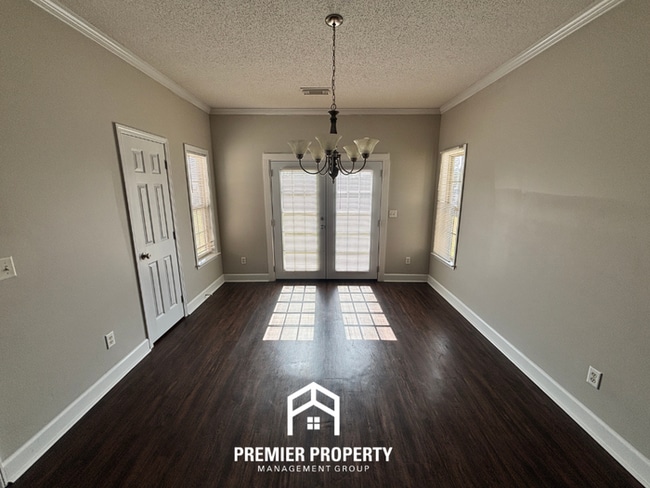 Building Photo - Charming 3BR Tuscaloosa Home | Hardwood Floors, Brick Fireplace, 2-Car Garage & Fenced Yard