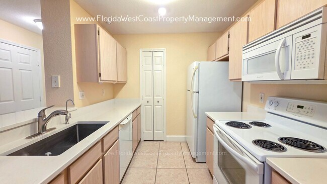 Building Photo - MOVE IN READY! LARGE 2 BEDROOM/2 BATH PLUS ATTACHED GARAGE! TILE/LVP THROUGHOUT!