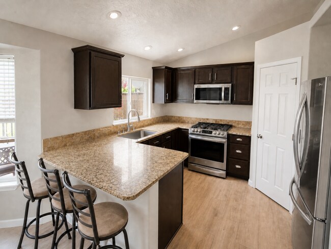 Building Photo - Spacious Home with 3-Car Garage, Two Living Areas & Covered Patio