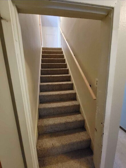 Stairs to upper level 2 bedrooms - 802 Le Hillier St