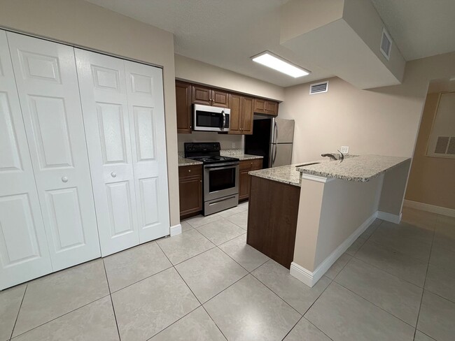 Building Photo - ANNUAL RENTAL - 2 BED / 2 BATH CONDO AT MYSTIC GARDENS