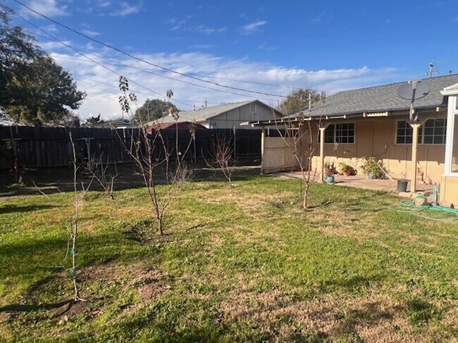 Building Photo - Charming Home with Expansive Yard, Fruit Trees & RV Parking