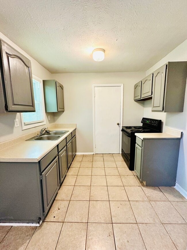 Building Photo - Updated three bedroom ranch in Okolona now...