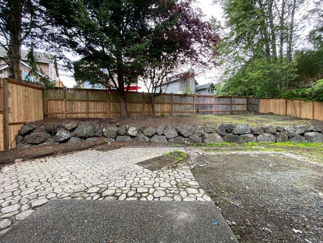 Building Photo - Stylishly Renovated Home with Private Back...